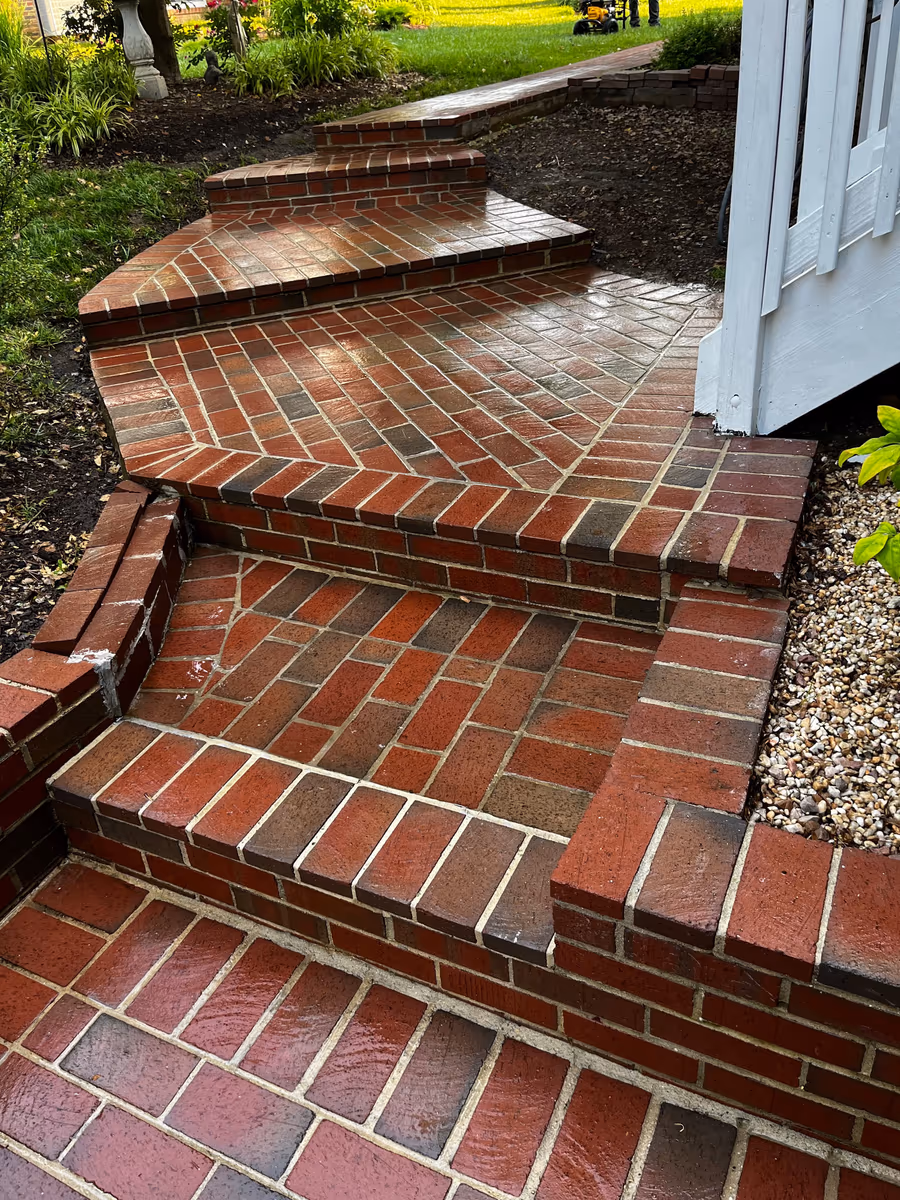 Brick steps and landing after power washing, mortar and brick colour restored